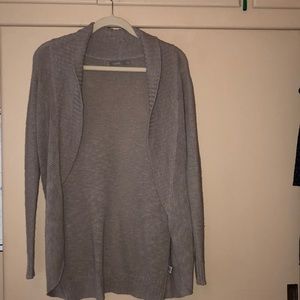 Tan colored long cardigan, goes to upper thigh